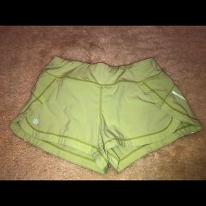 Athleta run with it shorts xxs light green
